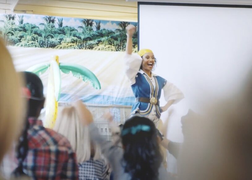 woman leading children activity in pirate costume