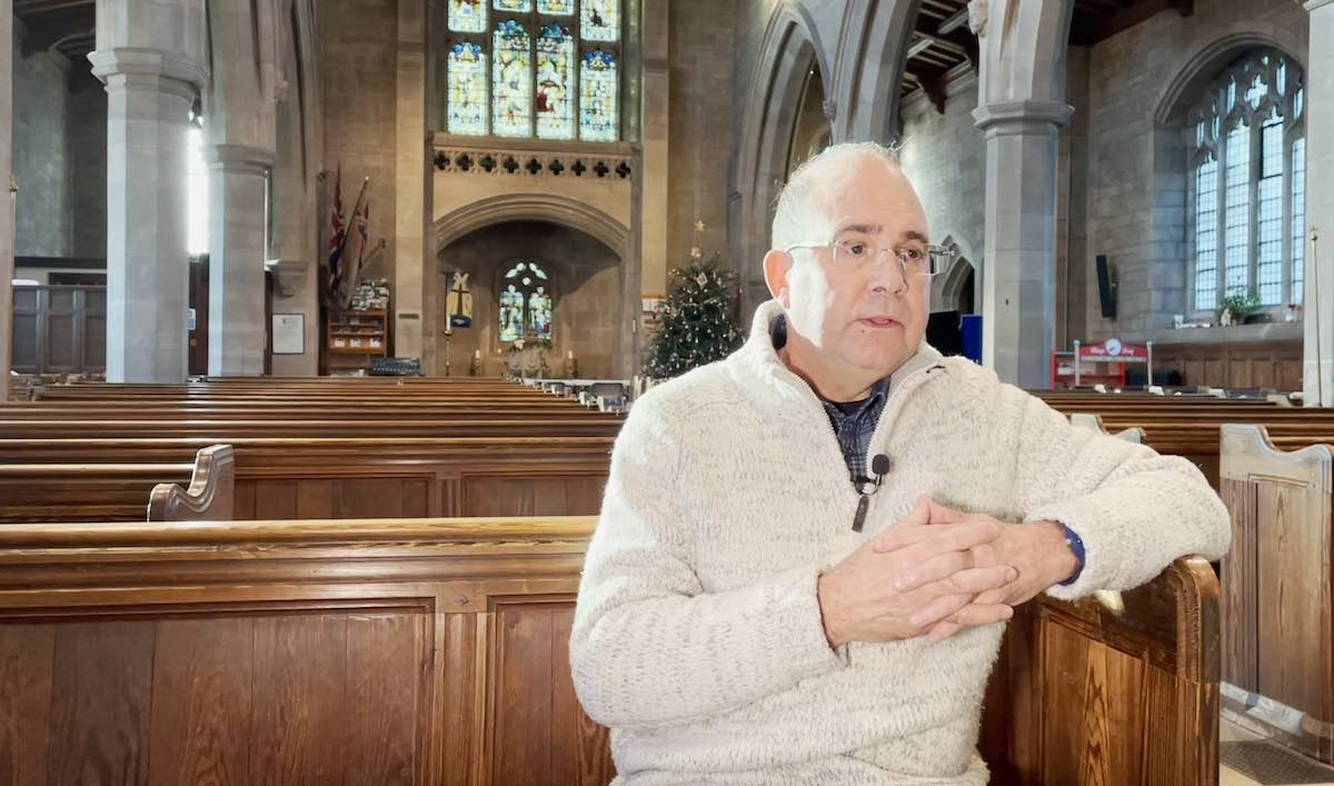 man in church in interview